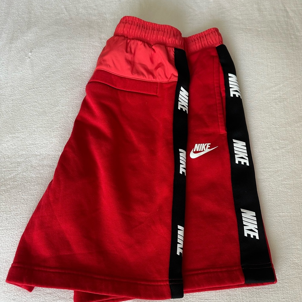 Nike Red Athletic Shorts with Black Stripe Accents